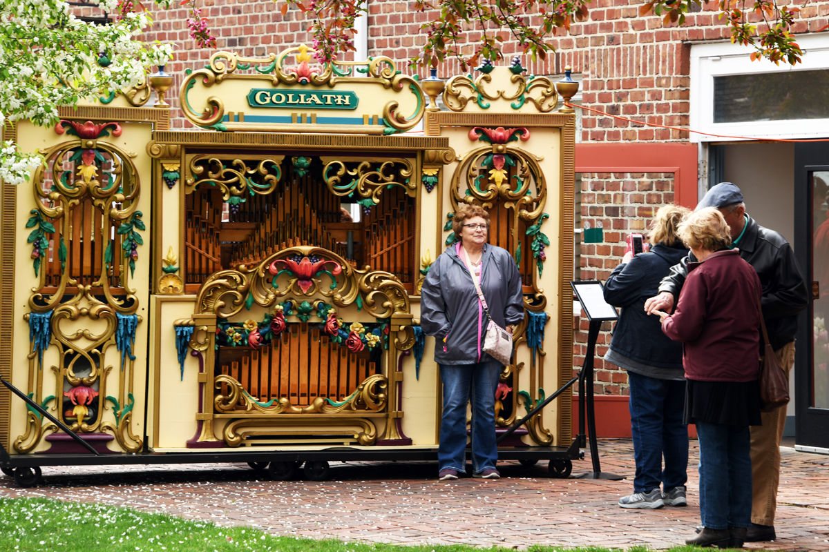 164 Susie Hageman with vintage nickelodeon in Pella Historical Village.JPG